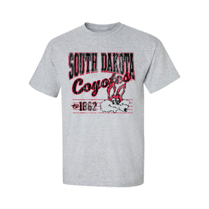 Gray tee with distressed screenprint in black and red text 'SOUTH DAKOTA Coyotes est. 1862' and a vintage Charlie Coyote face.