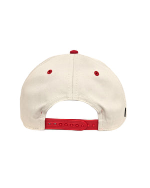Back of tan and red hat showing the adjustable snapback.