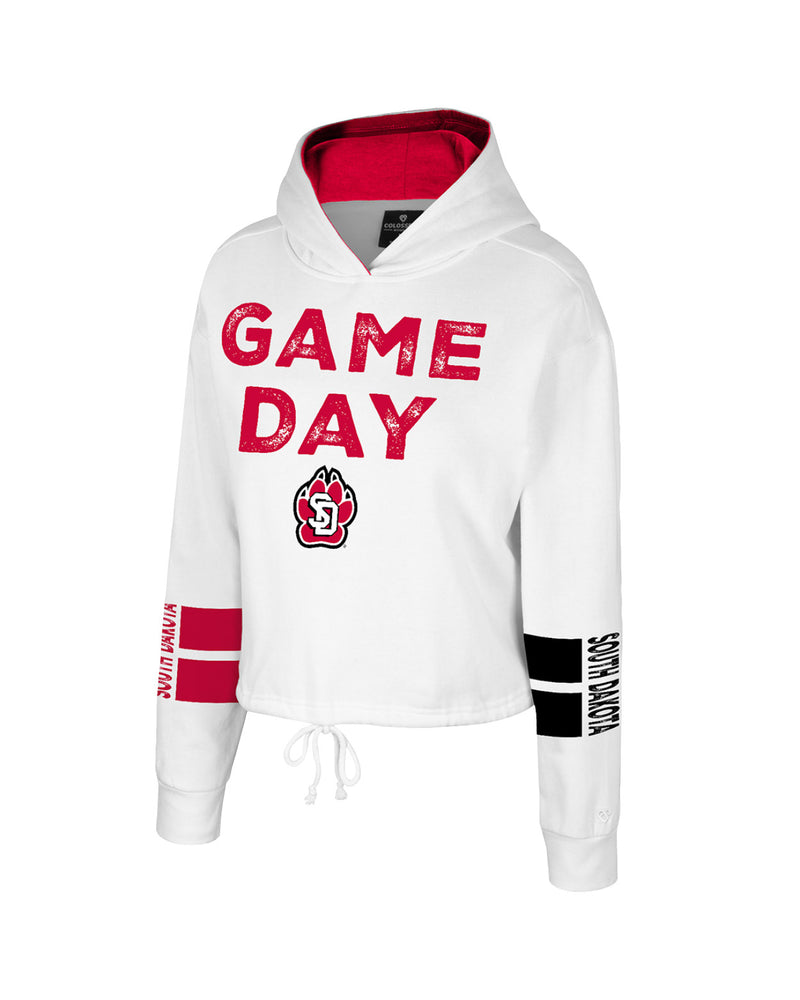 Women's white hoodie with draw string waist and red, 'GAME DAY,' with SD Paw logo large across chest, two red stripes on the right sleeve with, 'SOUTH DAKOTA,' and two black stripes on the left sleeve with, 'SOUTH DAKOTA.'