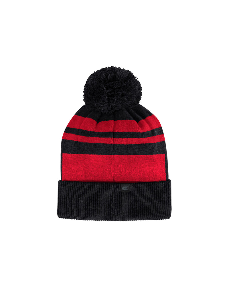 Back of red and black beanie with black pom puff on top. 