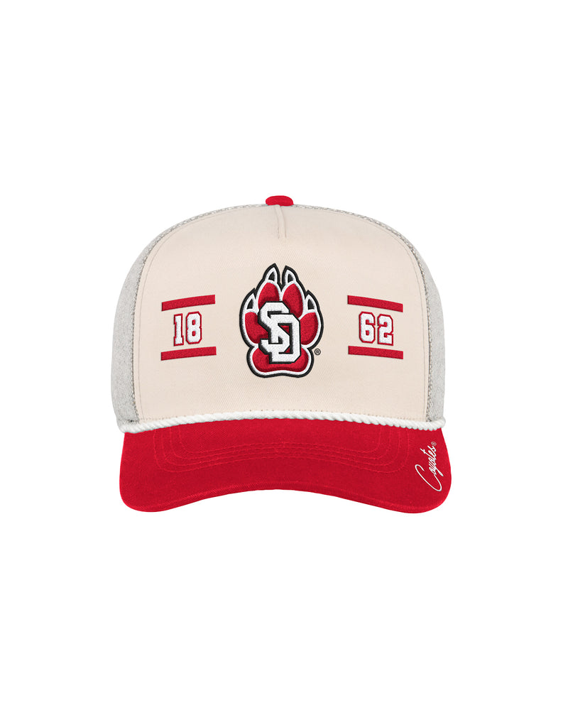 Baseball cap with red, beige, and gray color scheme with SD Paw logo at center and 18 on one side and 62 on the other, white rope and 'Coyotes' detail on bill.