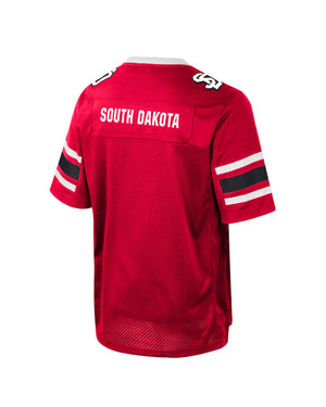 Back of red youth jersey with white, 'SOUTH DAKOTA,' across upper back and white and black SD logo on shoulders.