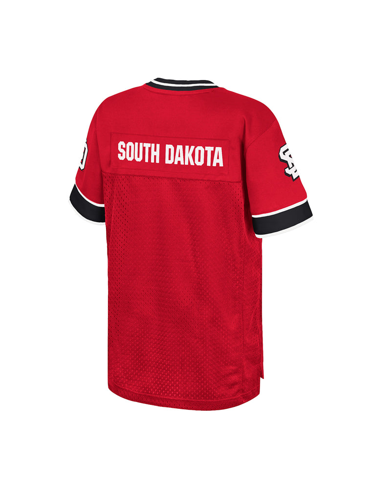Back of red youth jersey with 'South Dakota' printed in white across the back.