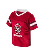 Red toddler football jersey with black and white stripes on sleeves and large SD Paw logo with, 'SOUTH DAKOTA' below on chest.