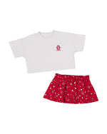 Toddler girls' white tee with SD Paw logo in heart on upper left chest and a red skirt with a silver heart and start pattern.