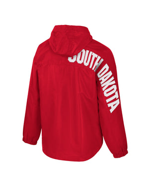 Back of men's red anorak jacket with hood and white, "SOUTH DAKOTA,' going down back right side and onto sleeve.