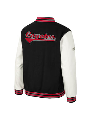Back of black and white letterman's style jacket with red accents and 'Coyotes' across the upper back.