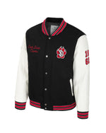Black and white letterman's style jacket with red accents, SD Paw chenille patch, embroidered 'South Dakota Coyotes', 1862 on the faux leather whitesleeves.