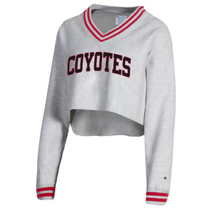 Champion Women's Ribbed V-neck gray cropped sweatshirt with red stripes along sleeve hems and neckline and black and red, 'COYOTES' across chest.