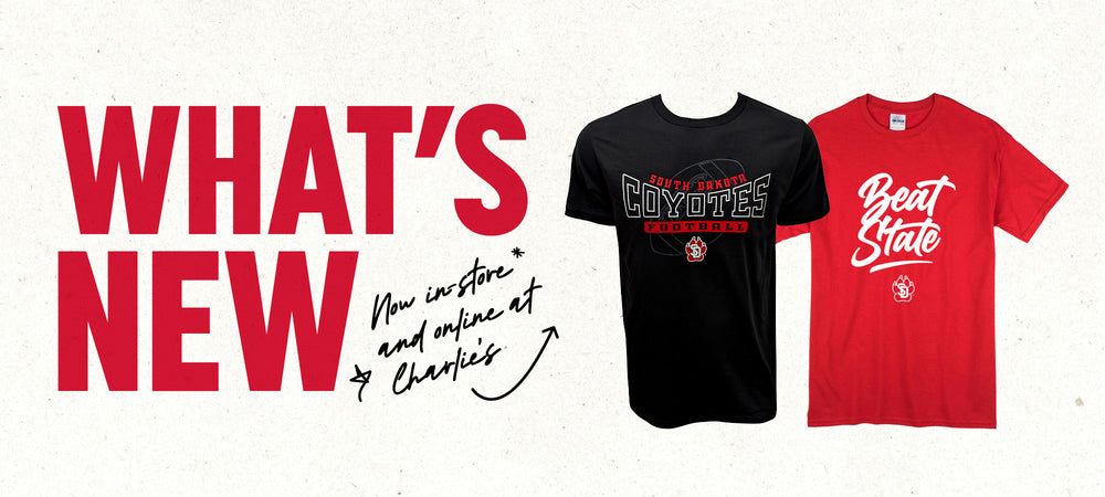 Graphic with paper textured background and red text, 'WHAT'S NEW,' with smaller black handwriting text, 'Now in-store and online at Charlie's,' with an arrow pointing to a black tee with 'SOUTH DAKOTA COYOTES FOOTBALL,' and a red tee with white graphic 'Beat State.'