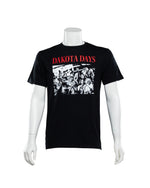Black tee with large black and white photo of USD fans from decades ago with red text above that says, 'DAKOTA DAYS.'