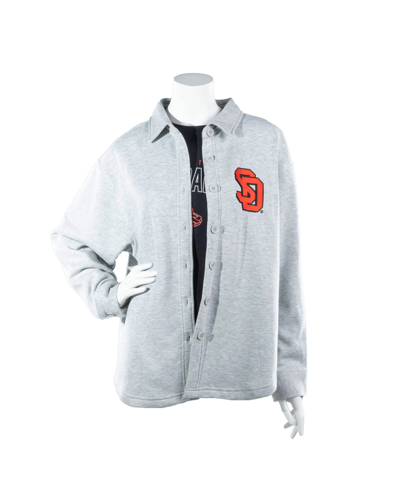 Gray women's shacket with gray buttons and red and black SD logo on upper left chest. 