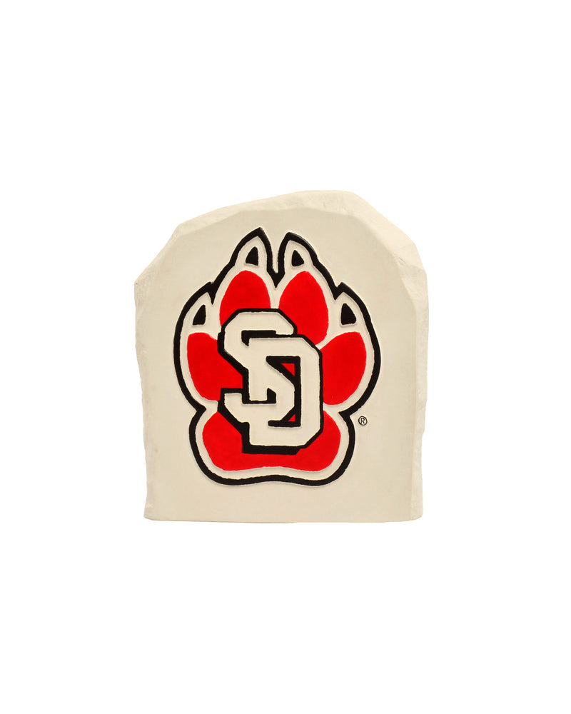 White decorative boulder with a red and black SD Paw logo