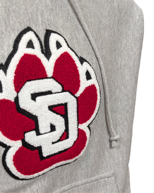 Close-up of chenille paw detailing on gray hoodie.