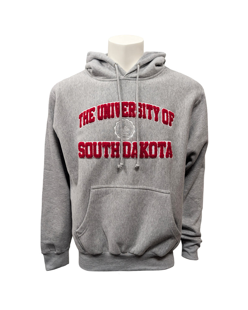 Gray hoodie with chenille red and white letters, 'THE UNIVERSITY OF SOUTH DAKOTA,' with white embroidered university seal in the center. 