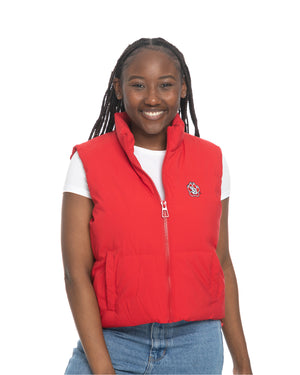 Young woman wearing a white tee with the red cropped puff vest over top zipped halfway up. Vest features full color SD Paw logo on upper left chest.