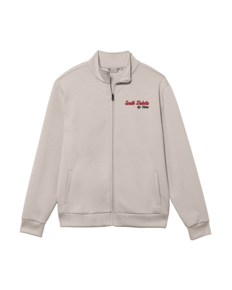 Cream full zip jacket with puff red and black embroidered 'South Dakota Go Yotes' on upper left chest.
