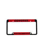 Silver and red license plate with the words, 'COYOTES SOUTH DAKOTA' 