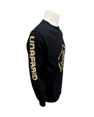 Side view of the black long-sleeve tee with tan design - a pentagon shape with American flag and text 'YOTES HONORING OUR HEROES' inside the shape across chest and 'UNAFRAID' on left sleeve.