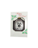 Silver ball ornaments with full color Charlie Coyote head painted on the front in a decorated box that says, 'Happy Holidays!'