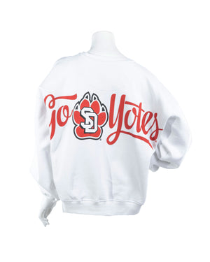 Back of white oversized women's crew with black, red and white SD Paw logo in center and script text, 'Go Yotes.'