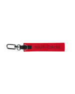 Red keychain strap with tonal text, 'south dakota,' and black detailing.