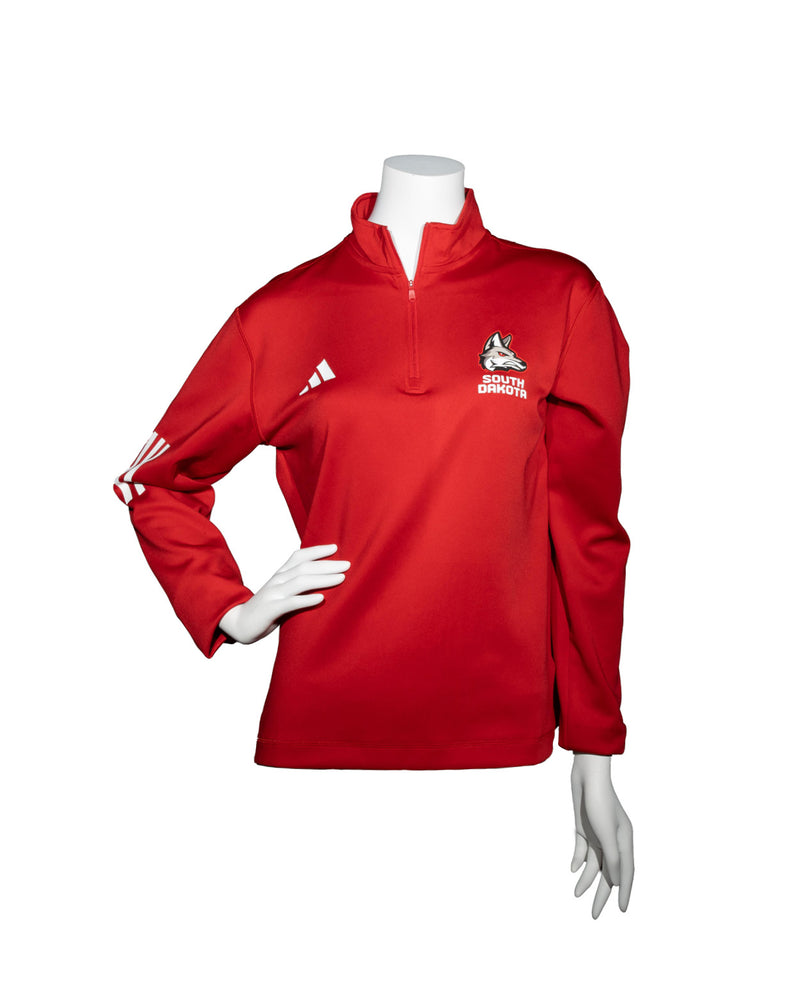 Red Adidas women’s half zip crew with three small white stripes on elbow area of sleeve, a white Adidas logo on upper right chest and full color new Coyote logo with white, ‘SOUTH DAKOTA,’ below on upper left chest.