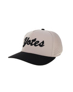 Beige and black cap with 'Yotes' script in black embroidery across front.