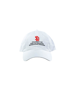 White hat with red embroidered SD logo and black text below, 'UNIVERSITY OF SOUTH DAKOTA BEACOM SCHOOL OF BUSINESS.'