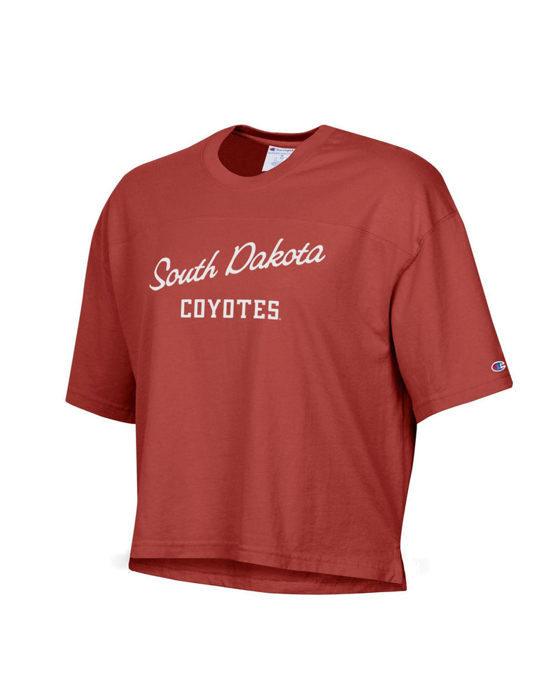 Red short sleeve cropped tee with white text, 'South Dakota COYOTES' across chest