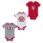 3 infant onesies - one gray with red details and, 'Coyotes,' in red, black and white; one white with red details and red and black text, 'SOUTH DAKOTA COYOTES,' around the SD PAW logo at middle; one red with larger SD Paw logo at chest. 