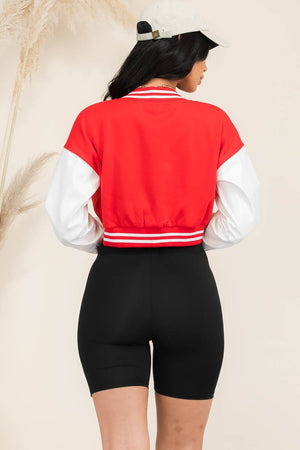 Back of Women's Faux Leather Cropped Red/White Varsity Jacket with snaps. Body is red, sleeves are white with red and white striped cuff.