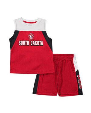 Red, white and black tank jersey that says South Dakota with the SD Paw on chest and matching shorts that say Coyotes down the side of one leg