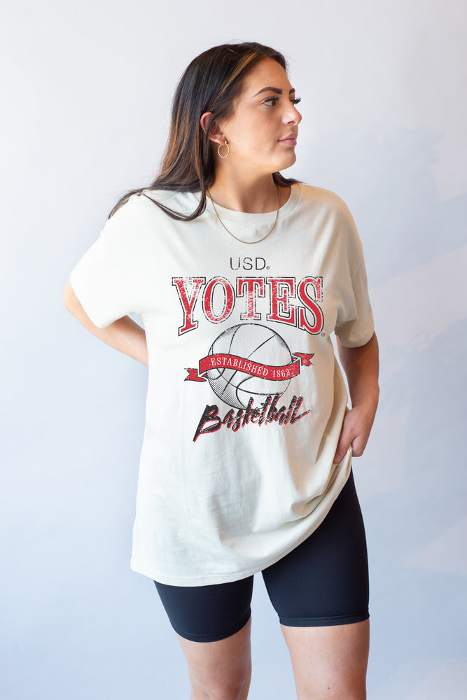 White oversized tee with Coyote basketball graphic