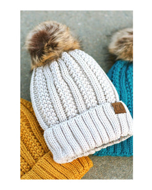 white CC Knit Hat Lined with a cozy layer of faux fur